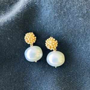 Sissy Yates “coral” and pearl pierced earrings.